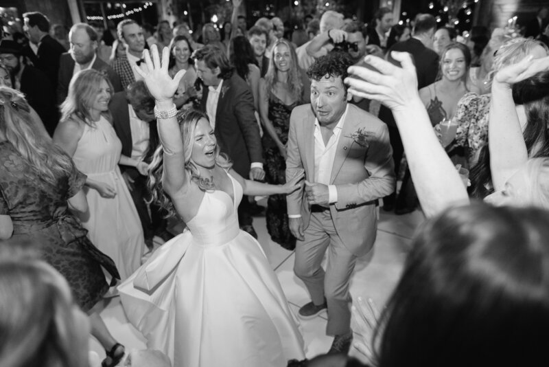Bride and groom celebrating on the dance floor at luxury wedding